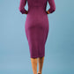 model is wearing diva catwalk ubrique pencil dress with sleeve and keyhole detail on a front panel in imperial purple back