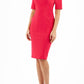 Model wearing Diva catwalk Derwent Pencil skirt dress with shoulder pads and short sleeves and pockets on both sides and empire waistline in pink front