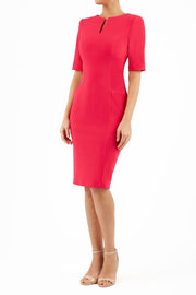 Model wearing Diva catwalk Derwent Pencil skirt dress with shoulder pads and short sleeves and pockets on both sides and empire waistline in pink front