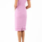 Model wearing the Diva Branwell Pencil dress with tie on shoulders in dawn pink back image