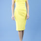 model wearing diva catwalk Bodiam Bodycon Pencil Dress with frill sleeves in knee length and pleating across the tummy in blazing yellow front
