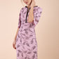 Model wearing the Diva Memphis Print dress dress in pencil dress design in dawn pink fern print front image