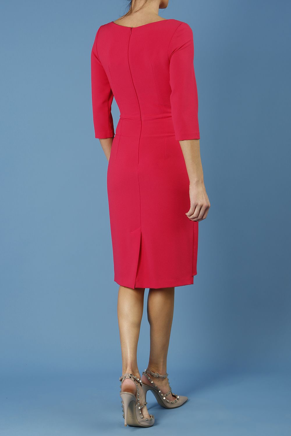 model is wearing diva catwalk jacky dress with rounded neckline 3/4 sleeve and bow detail on the waist in honeysuckle pink back 