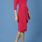 model is wearing diva catwalk jacky dress with rounded neckline 3/4 sleeve and bow detail on the waist in honeysuckle pink front 