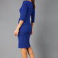 model is wearing diva catwalk jacky dress with rounded neckline 3/4 sleeve and bow detail on the waist in oxford blue side