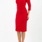 brunette model wearing diva catwalk evening pencil dress off shoulder with sleeves and pleated pencil skirt in colour scarlet red front