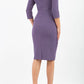model wearing diva pencil dress tulip design with overlapping pencil skirt with 3 4 sleeves in colour dark mauve back