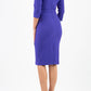 model wearing diva pencil dress tulip design with overlapping pencil skirt with 3 4 sleeves in colour spectrum indigo back