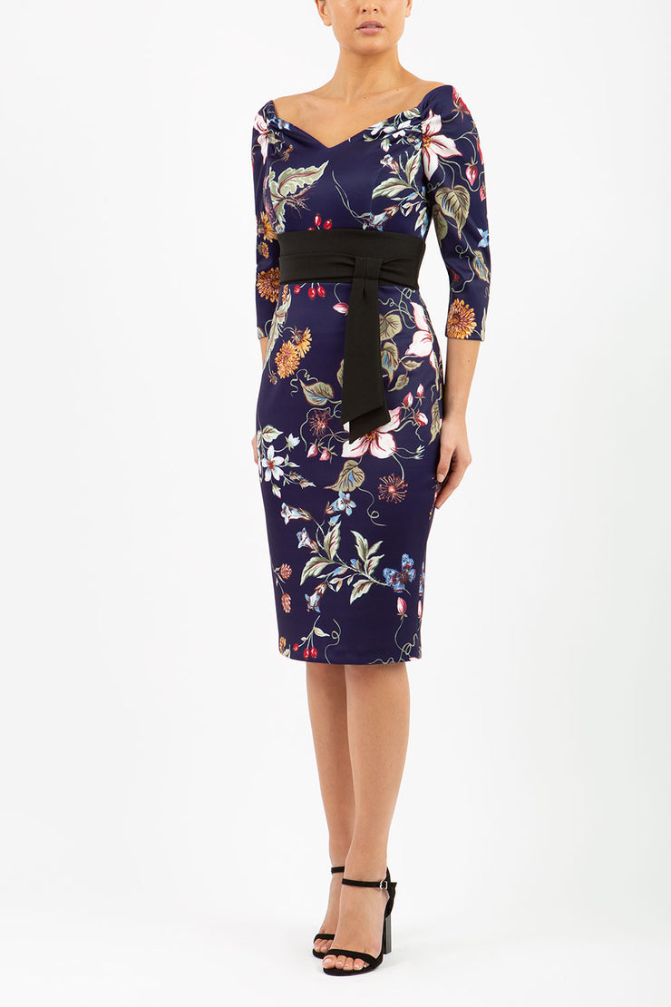 model wears Alpa Print off the shoulder pencil Dress with long sleeves wild flower print front image