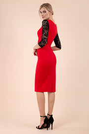 blonde model wearing diva catwalk haversham three quarter contrast pencil dress with lace detail across arms and neckline with pleating cross body in red and black back
