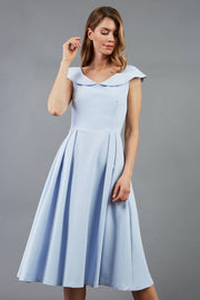model is wearing divacatwalk Chesterton Sleeveless a-line swing dress in celestial blue with oversized collar front
