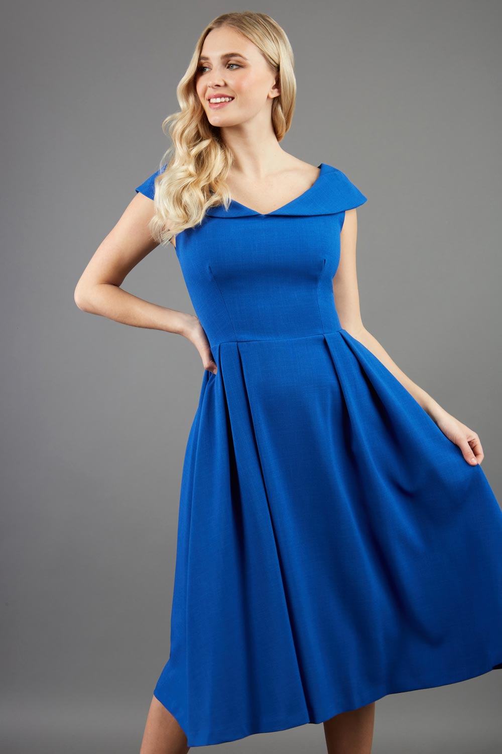 model is wearing divacatwalk Chesterton Sleeveless a-line swing dress in cobalt royal blue with oversized collar front