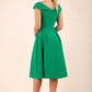 blonde model wearing diva catwalk Chesterton Swing Sleeveless dress in emerald green back