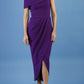 brunette model is wearing the divacatwalk vegas midazi calf lebgth dress off shoulder in deep purple front