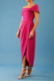 brunette model is wearing the diva catwalk vegas midaxi calf length dress off shoulder in magenta side