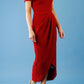 brunette model is wearing the diva catwalk vegas midaxi calf length dress off shoulder in rosewood red side