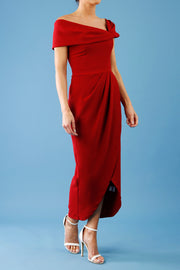 brunette model is wearing the diva catwalk vegas midaxi calf length dress off shoulder in rosewood red side