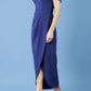 brunette model is wearing the diva catwalk vegas midaxi calf length dress off shoulder in navy blue side