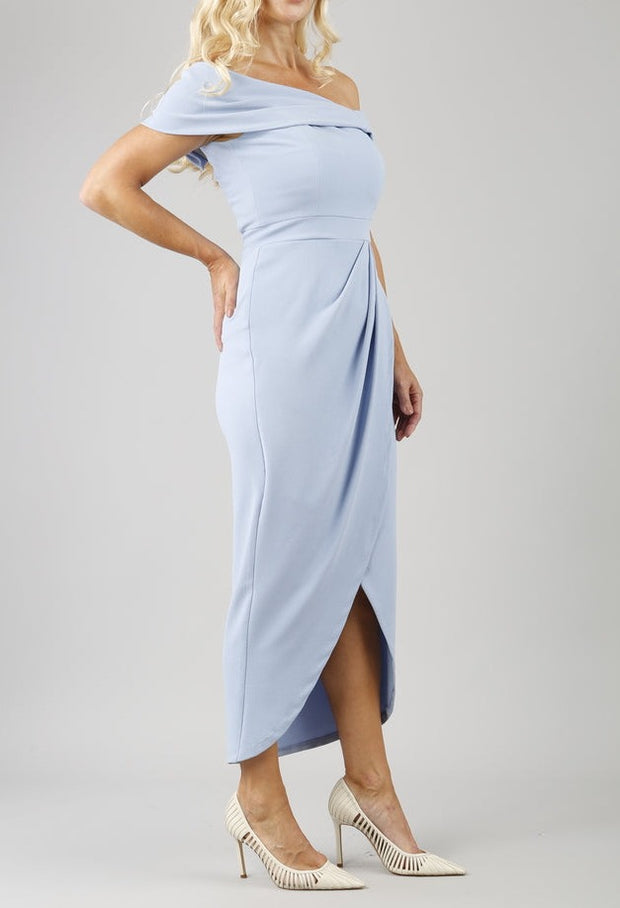 model wearing diva catwalk vegas calf length powder blue midaxi dress with wide bardot neckline and open shoulders with a large opening at the front of the skirt with pleating coming down long skirt front