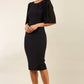 brunette model is wearing diva catwalk black pencil black dress with  bow front image