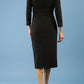 model is wearing diva catwalk osaka black pencil dress with sparkle contrasting detail on sleeves and v-neckline back