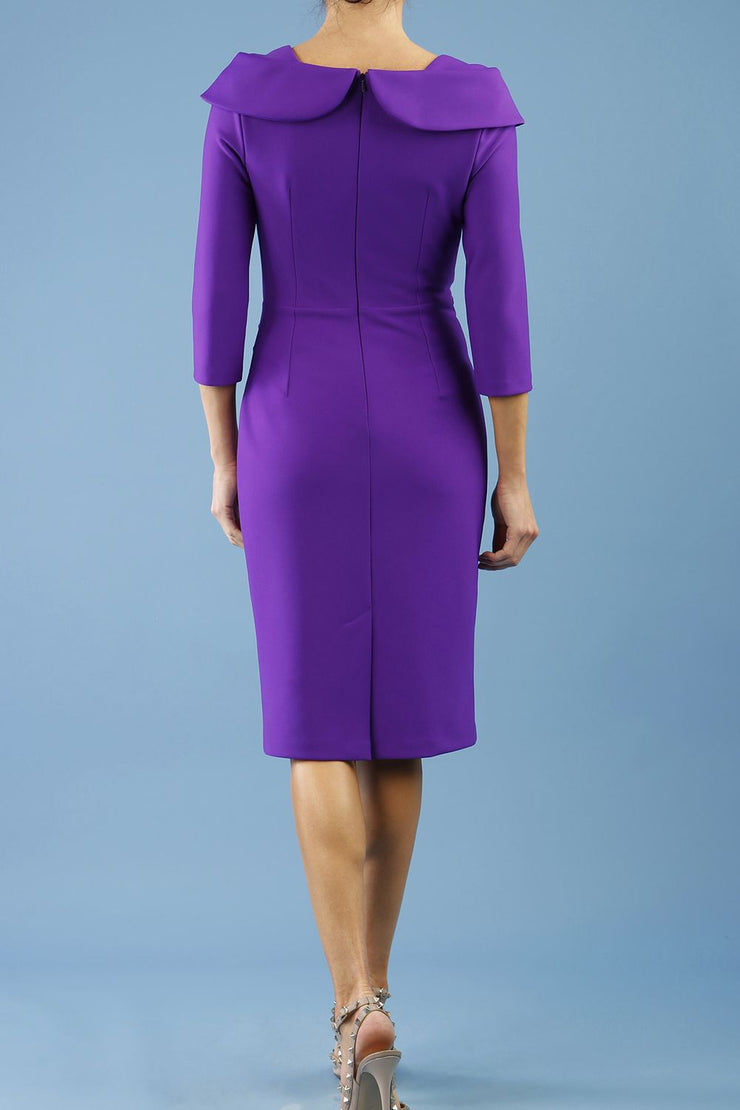 brunette model is wearing diva catwalk pencil dress with collar and a button detail on a side with 3/4 sleeve in passion purple back