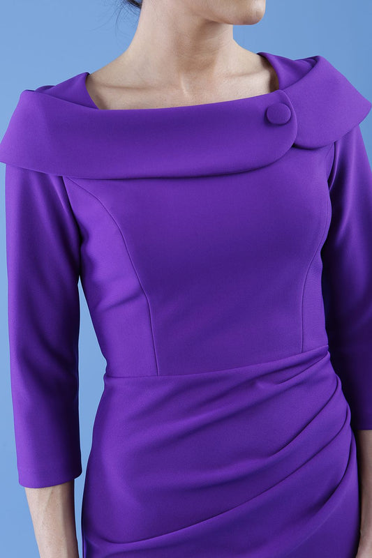 brunette model is wearing diva catwalk pencil dress with collar and a button detail on a side with 3/4 sleeve in passion purple front