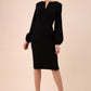 Blonde model wearing Diva Catwalk Praktica long puffed bishop sleeves knee length empire line pencil dress with round neckline with a slit cut in the middle in Black front