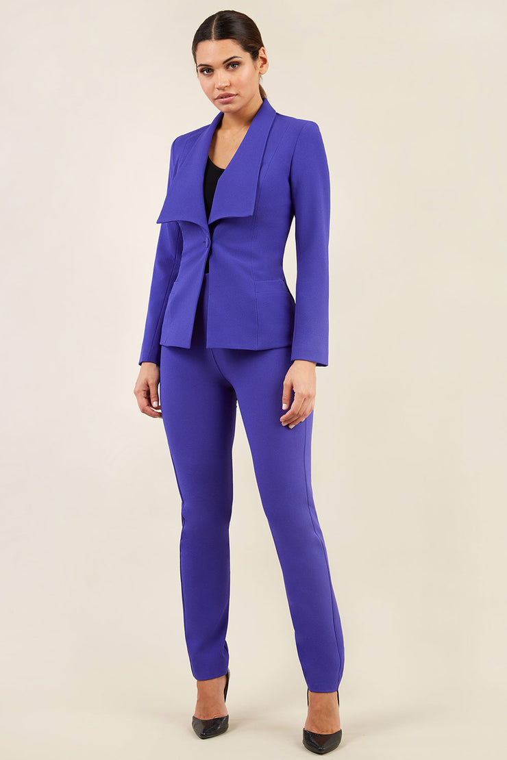 brunette model wearing diva catwalk straight ankle length trousers in spectrum indigo with fulica jacket in spectrum indigo front
