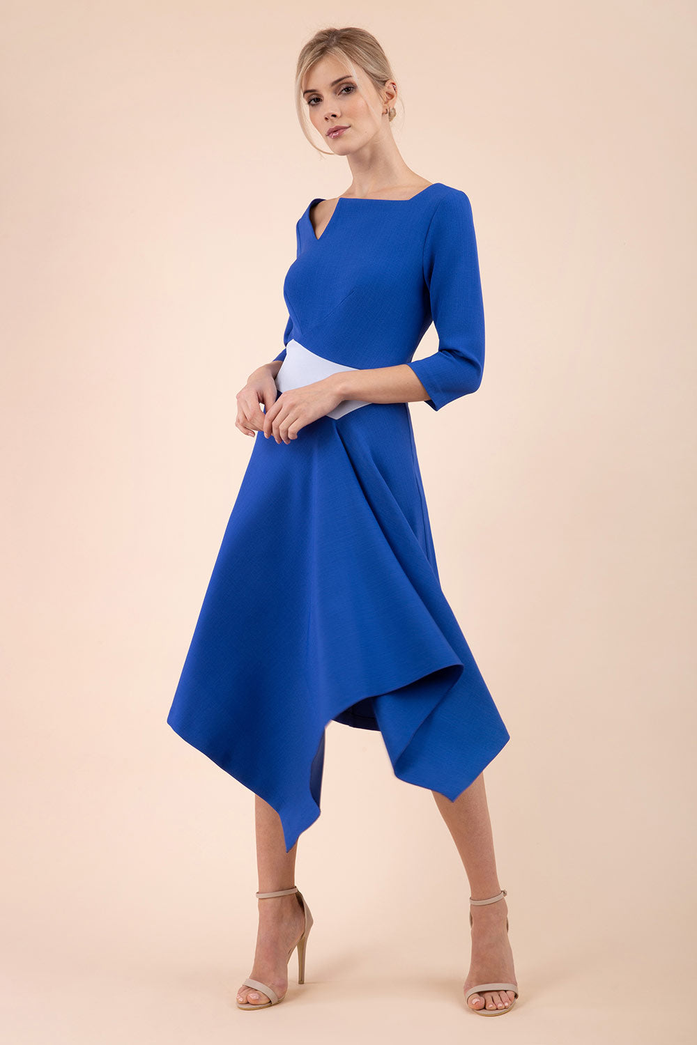 Blonde Model wearing Diva Catwalk Pinto Contrast swing a-line skirt Dress with asymmetric skirt and asymmetric neckline with three quarter sleeve in Cobalt Blue front