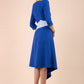 Blonde Model wearing Diva Catwalk Pinto Contrast Swing Dress with asymmetric skirt and asymmetric neckline with three quarter sleeve in Cobalt Blue back