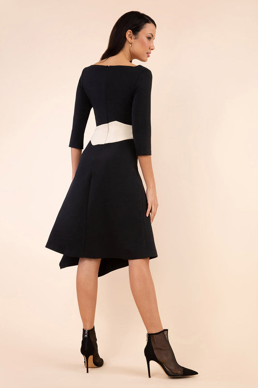 Model wearing Diva Catwalk Pinto Contrast swing a-line skirt Dress with asymmetric skirt and asymmetric neckline with three quarter sleeve in black and cream