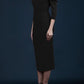 brunette model wearing diva catwalk zorita maxi pencil three quarter fitted dress off-shoulder with bardot neckline and buttons to front with pockets and vent on a skirt in bkack front