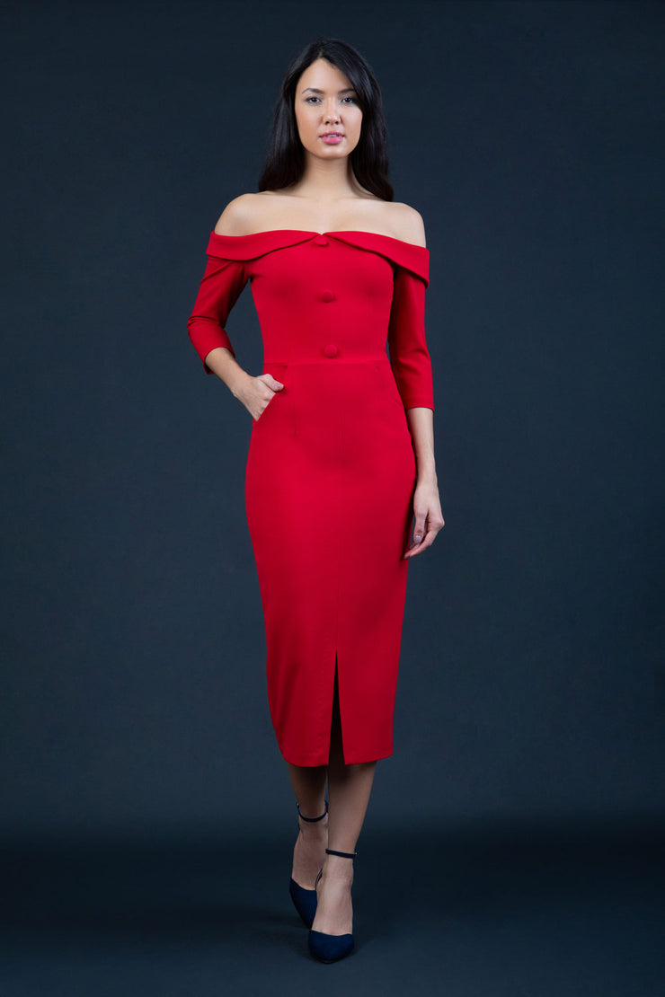 brunette model wearing diva catwalk zorita maxi pencil three quarter fitted dress off-shoulder with bardot neckline and buttons to front with pockets and vent on a skirt in scarlet red front