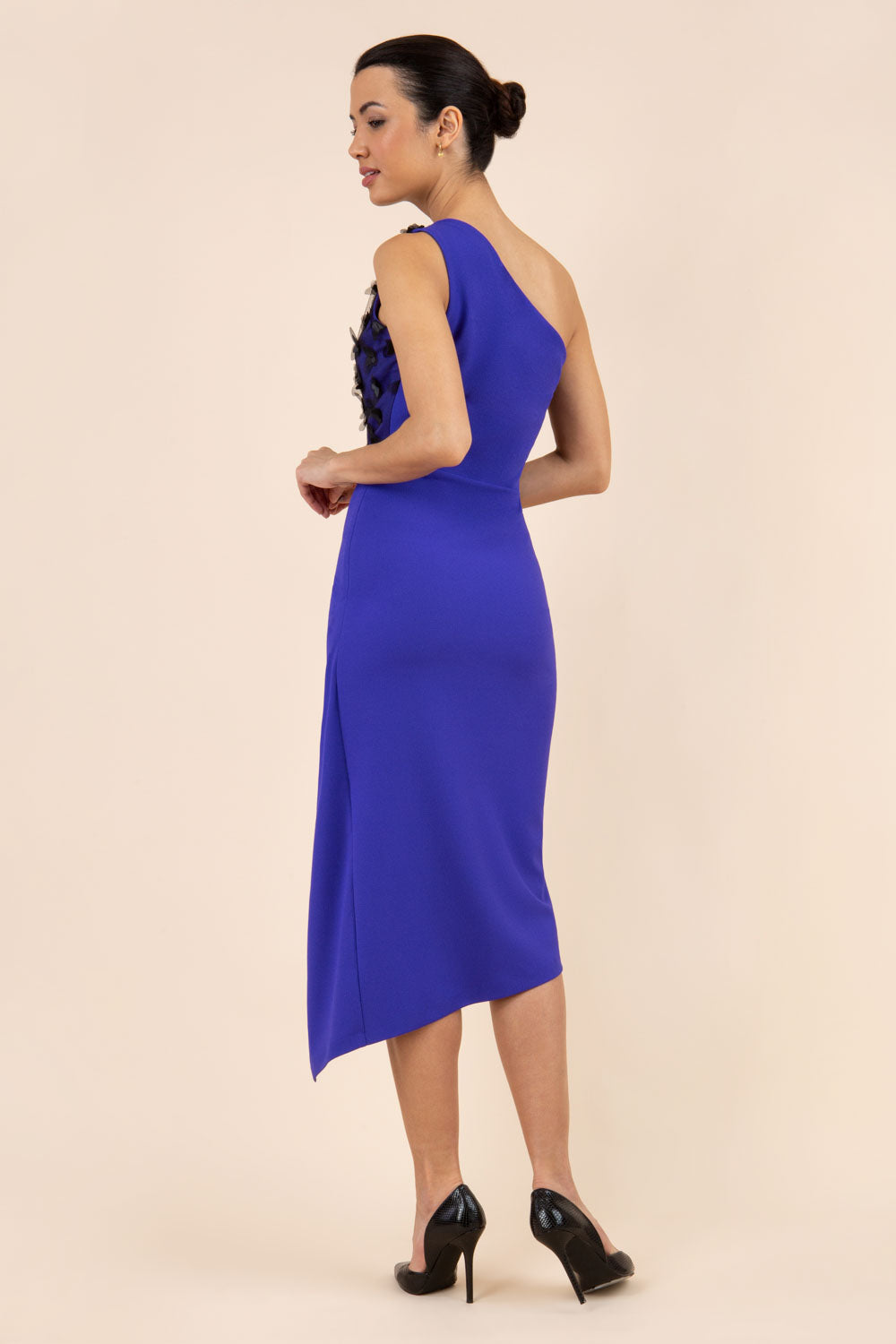 Model wearing the Diva Winslow dress in asymmetric design, one shoulder in spectrum indigo colour back