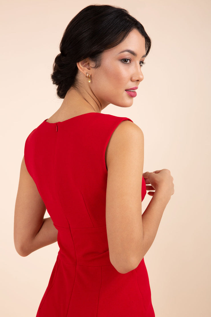 brunette model wearing diva catwalk pencil-skirt red dress with v-neckline and pleating across the tummy without sleeves back