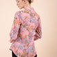 Model wearing the Diva floral top in pink back image