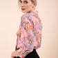 Model wearing the Diva floral top in pink front image