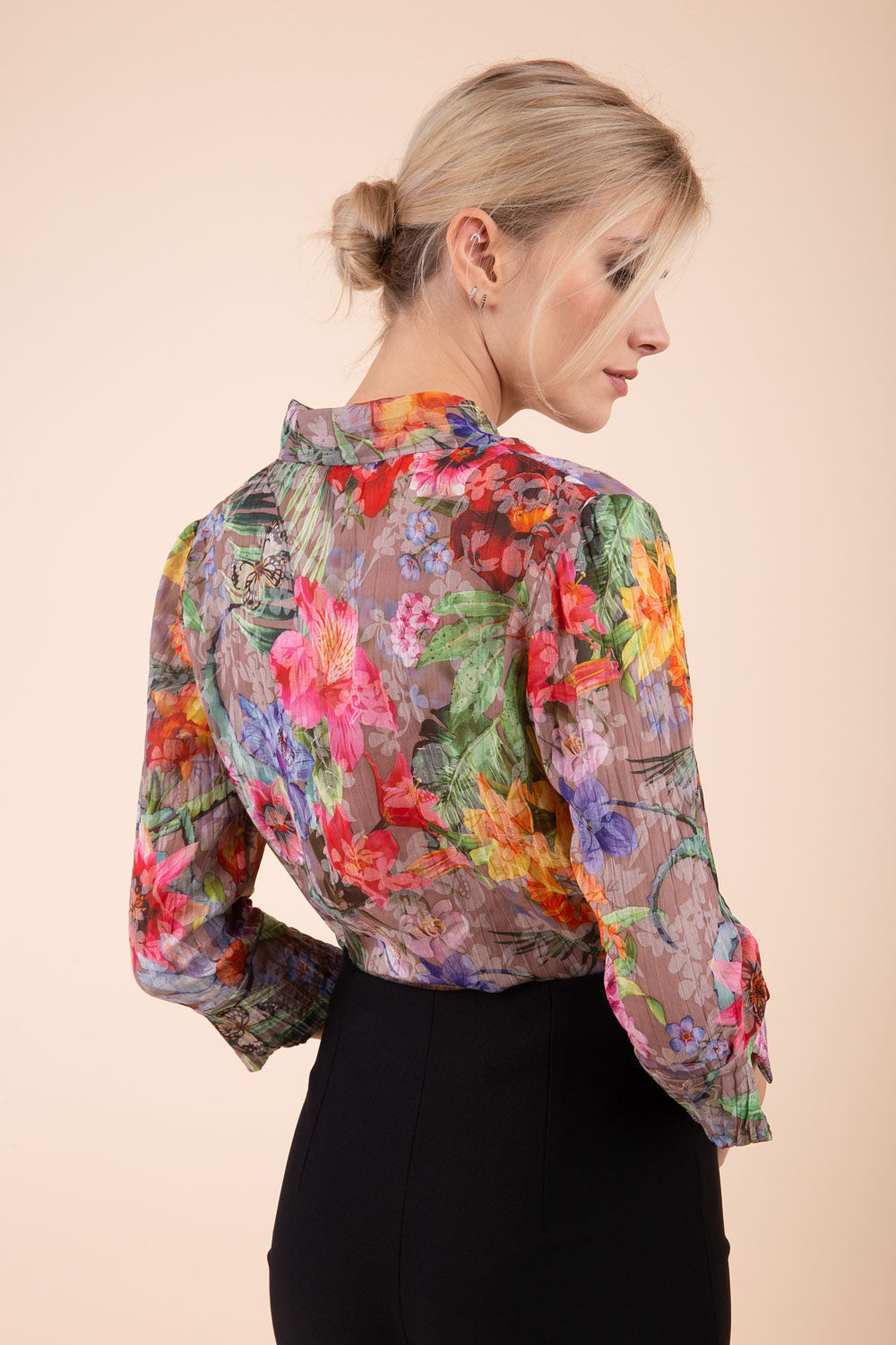Model is wearing the Diva Branscombe 3/4 Sleeve blouse in floral print taupe back image 