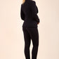 Blonde model wearing Diva Catwalk Fulica Long Sleeve One Button Oversized Collar Jacket in Black back