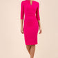 brunette model wearing diva catwalk best selling lydia pencil sleeved dress with slit at the neckline and pleating across the tummy in colour magenta pink front