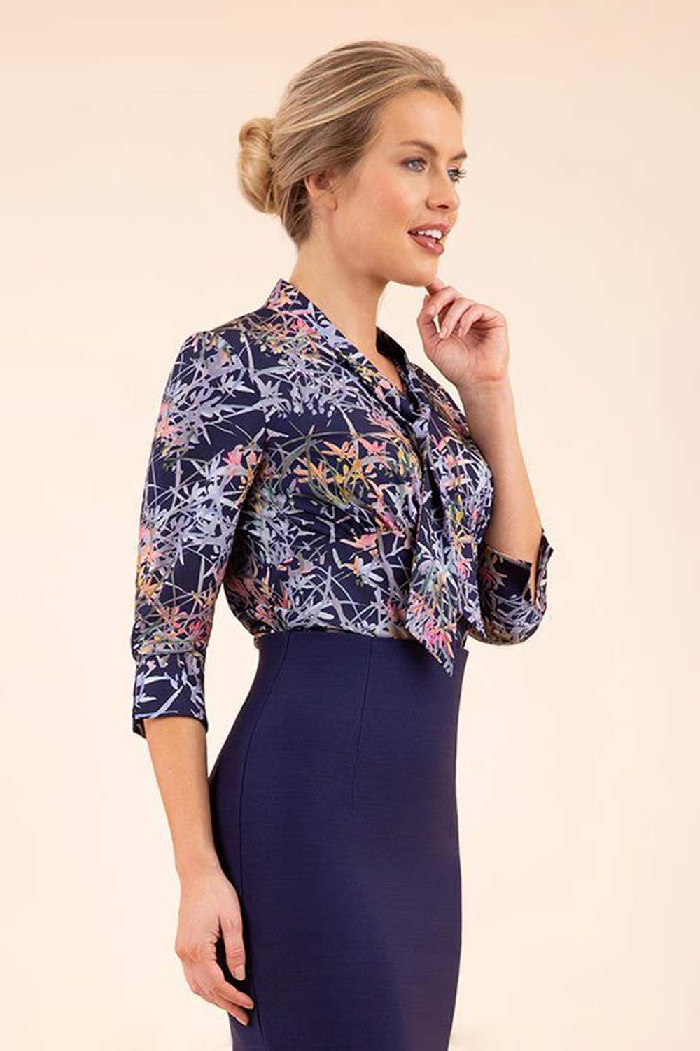 Model wearing the Diva floral top in navy blue front image