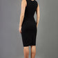 blonde model wearing diva catwalk pastiche pencil fitted sleeveless dress v-neckline with lace overlay in black back