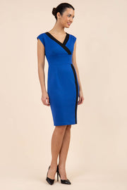 brunette model wearing Diva catwalk Suzy pencil sleeveless dress with v-neckline and wide wasteland in cobalt blue front