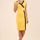 brunette model wearing Diva catwalk Suzy pencil sleeveless dress with v-neckline and wide wasteland in radiant yellow front