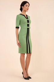 Model wearing the Diva Goggle pencil dress design in green with black, colour block detailing front image