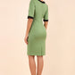 Model wearing the Diva Goggle pencil dress design in green with black, colour block detailing back image
