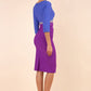 Model wearing the Diva Lara Colour Block pencil dress Couture Stretch seed three quarter sleeve in Amethyst Purple, Thistle Blue , Sky Grey colour back