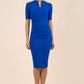blonde model is wearing diva catwalk lydia short sleeve pencil fitted dress in royal blue colour with rounded neckline with a slit in the middle front