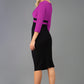 A model is wearing a three quarter sleeve colour block pencil dress by Diva Catwalk in Black and Purple colour back image